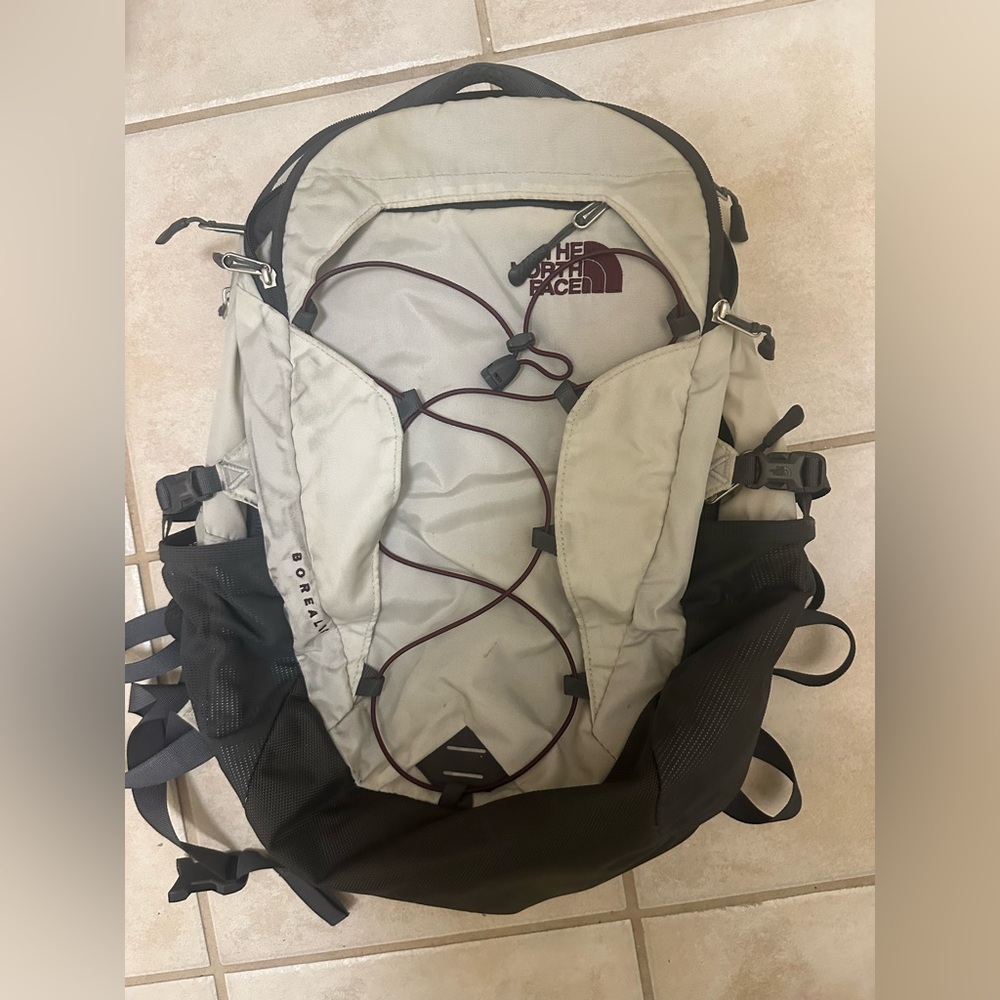 The North Face Cream and Black Backpack